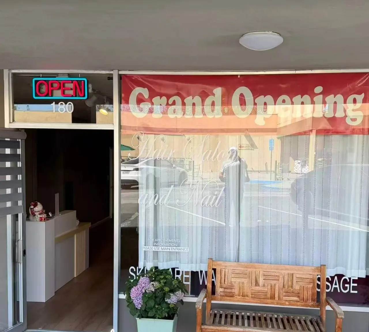 The Organic Day Spa shopfront on California Avenue in Palo Alto, with a bench and hydrangea outside Suite 180